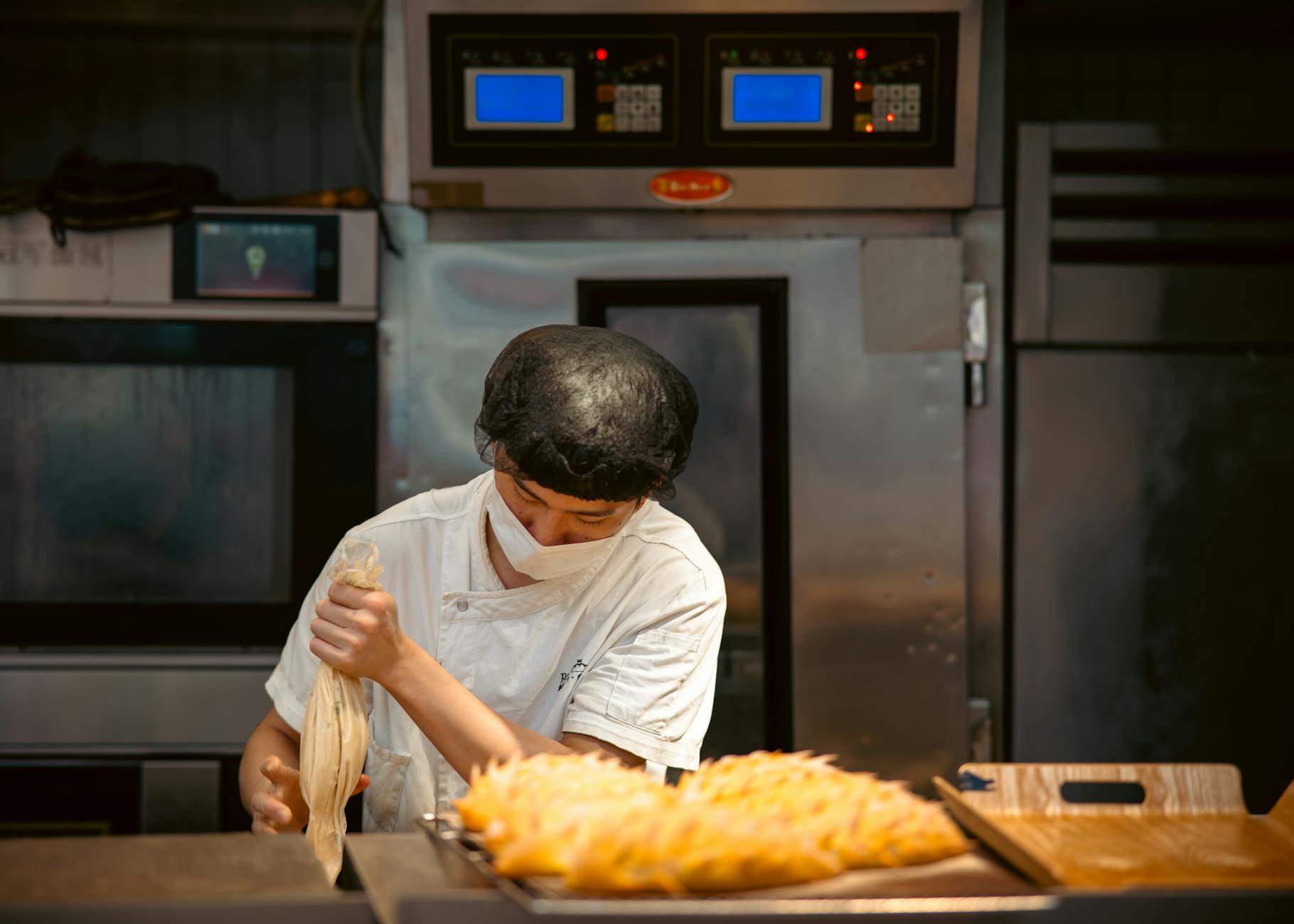 Chef preparing pastries in a professional kitchen